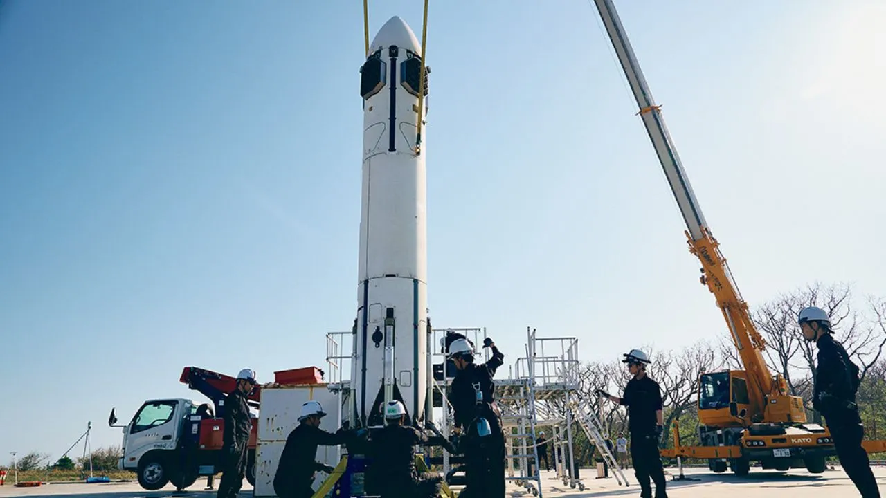 Technicians and Engineers readying the Honda rocket for launch