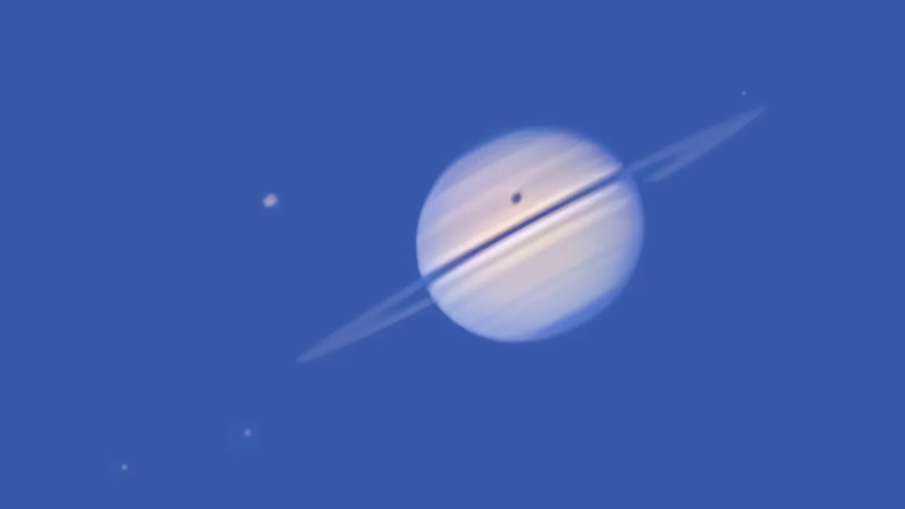 A rare solar eclipse on Saturn, caused by its largest moon, Titan, with other moons—Dione, Tethys, and Enceladus—visible in the frame.