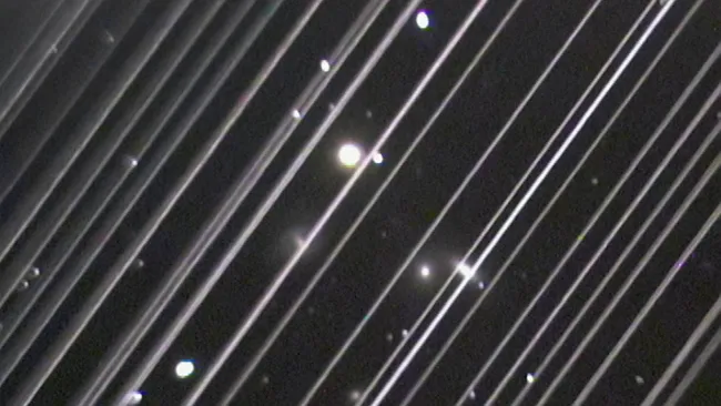 A SpaceX Starlink satellite trail captured in an image by a telescope.