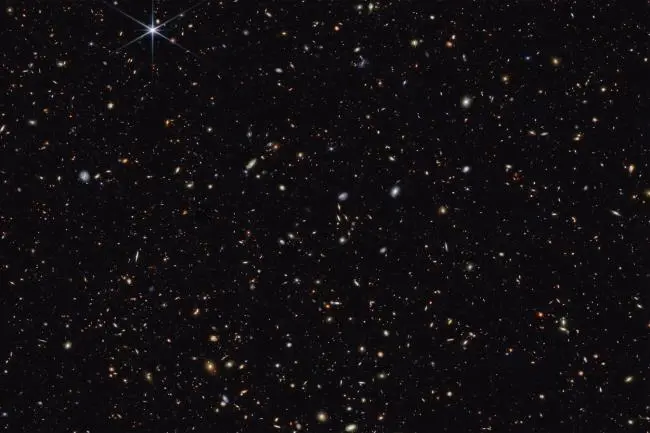 This deep field image from the James Webb Space Telescope shows distant galaxies scattered across the night sky.