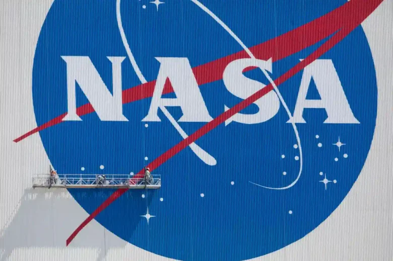 Painting of NASA logo on NASA's Vehicle Assembly Building (VAB).