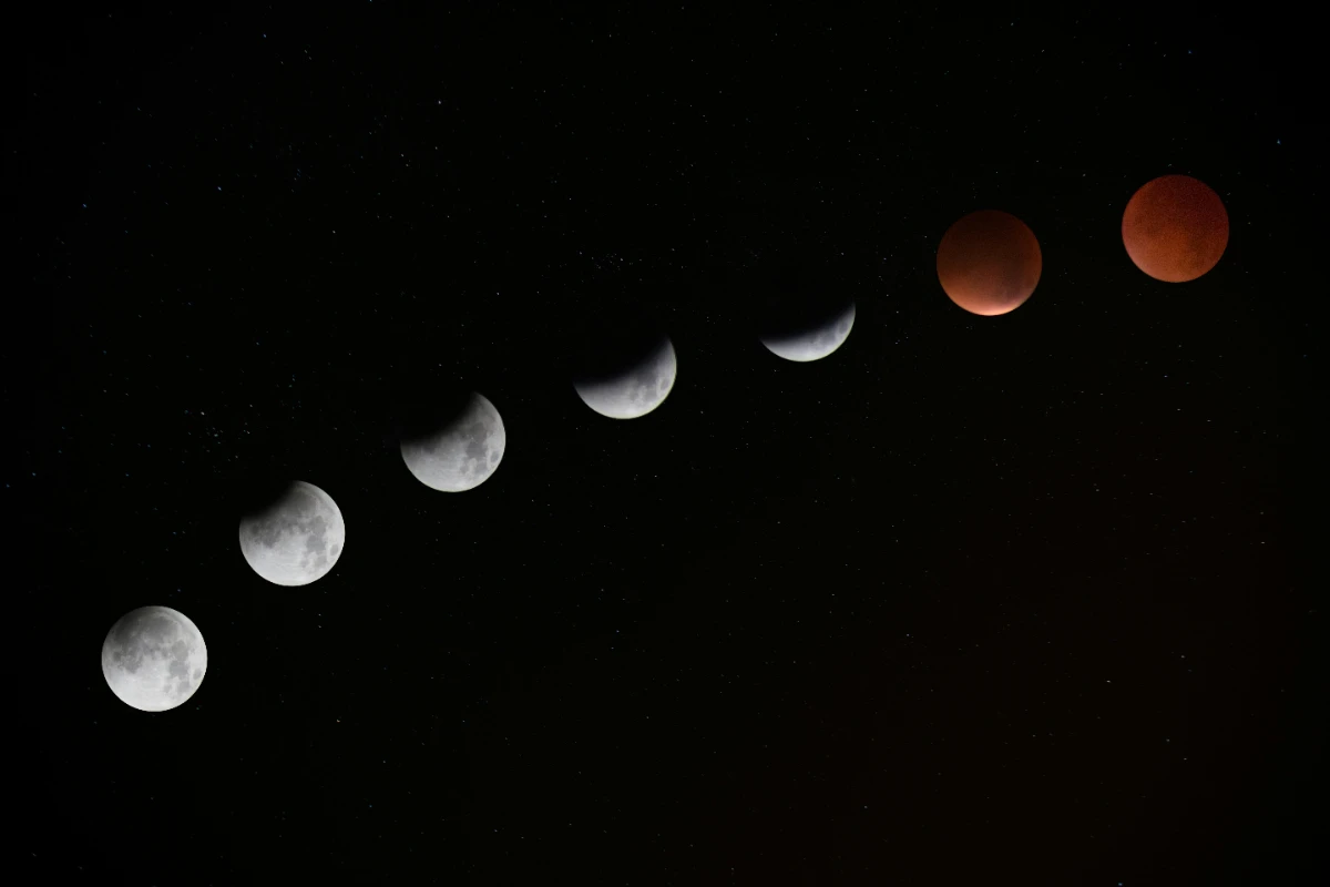 A composite image showing the Moon turning red during an eclipse.
