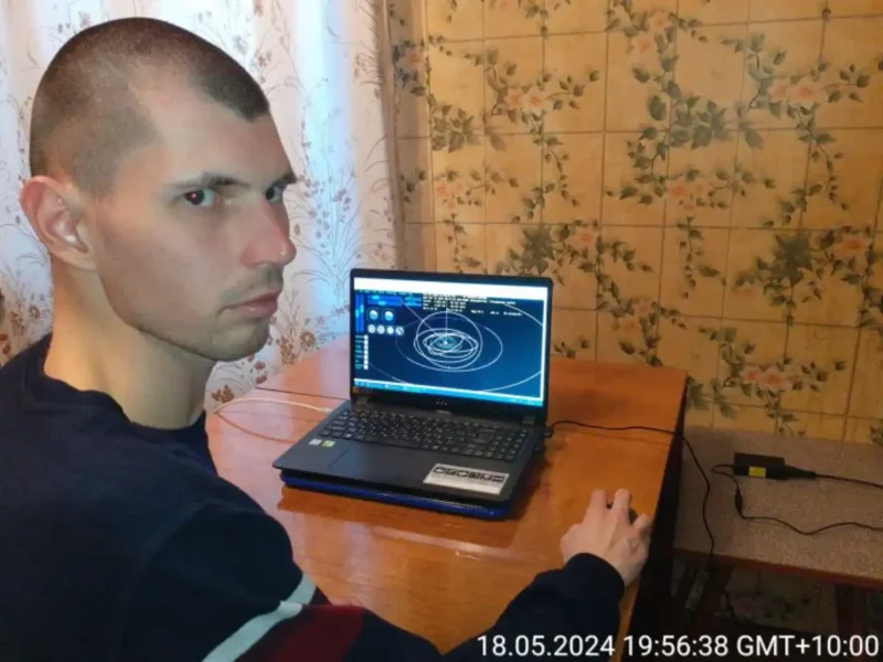 Russian Amateur Astronomer Filipp Romanov on his laptop.