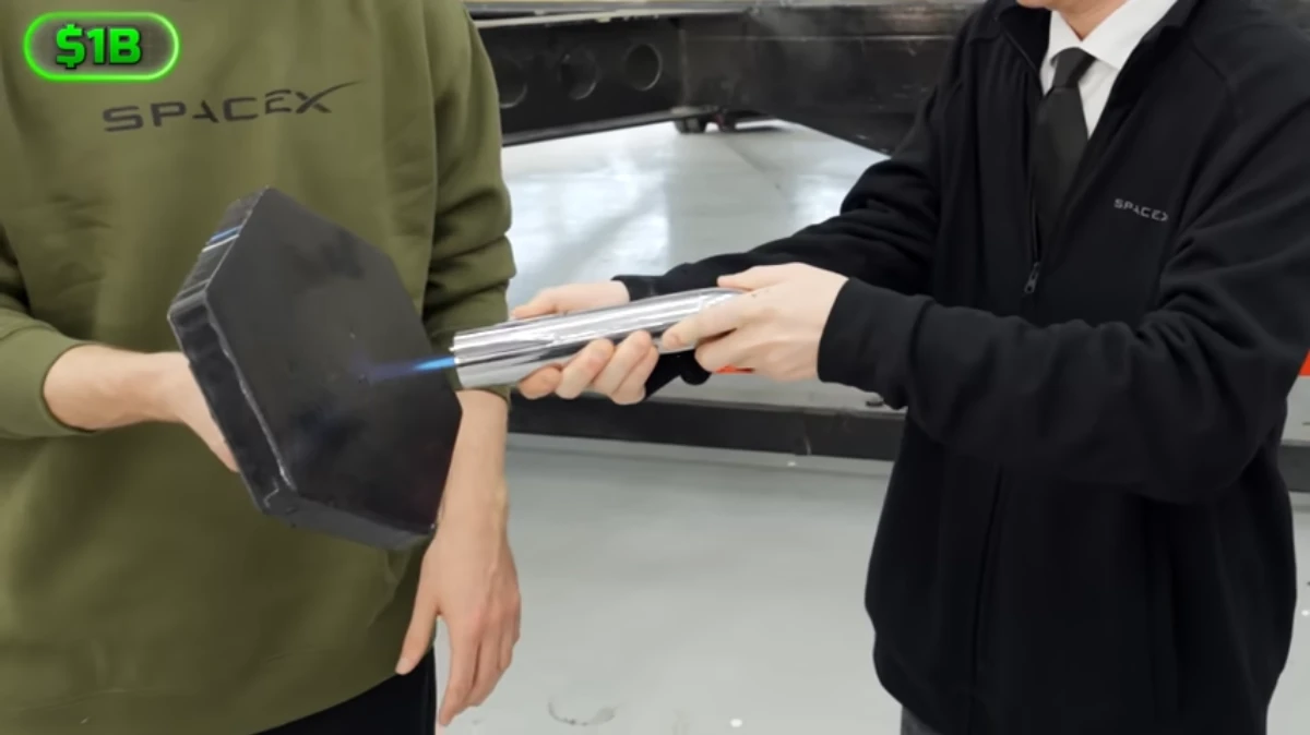 MrBeast testing a SpaceX Starship heat shield tile with a Starship-shaped blowtorch.