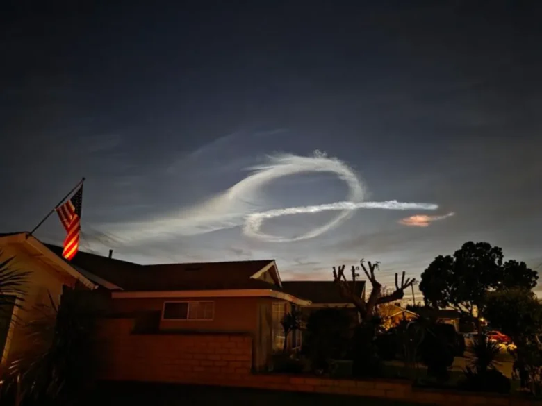 Grok ai logo painted in the sky by Falcon 9.